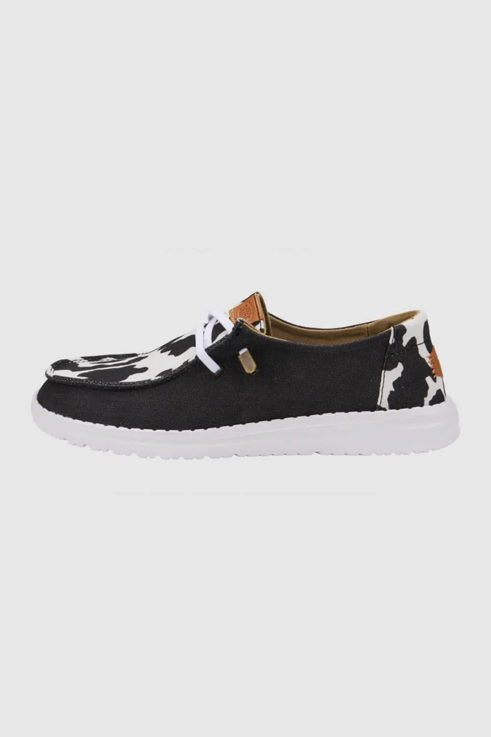 HEYDUDE Women’s Wendy Cow Print Shoes in Black/White | 41037-0HO